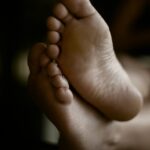 a close up of a person's bare feet